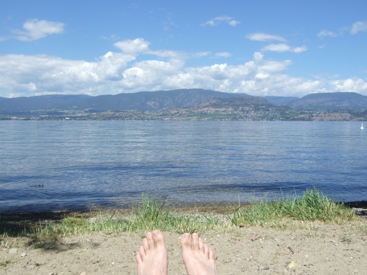 Laying on the beach in Kelowna