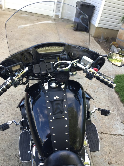 The view from he seat. The bank bib was custom made and I added the chrome cover above it.  The drink and GPS holders were taken from Silver and reattached to Midnight. 